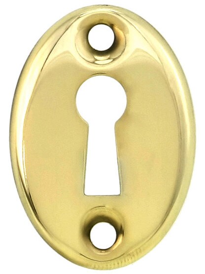 Stamped Brass Oval Keyhole Cover in Un-Lacquered Brass.
